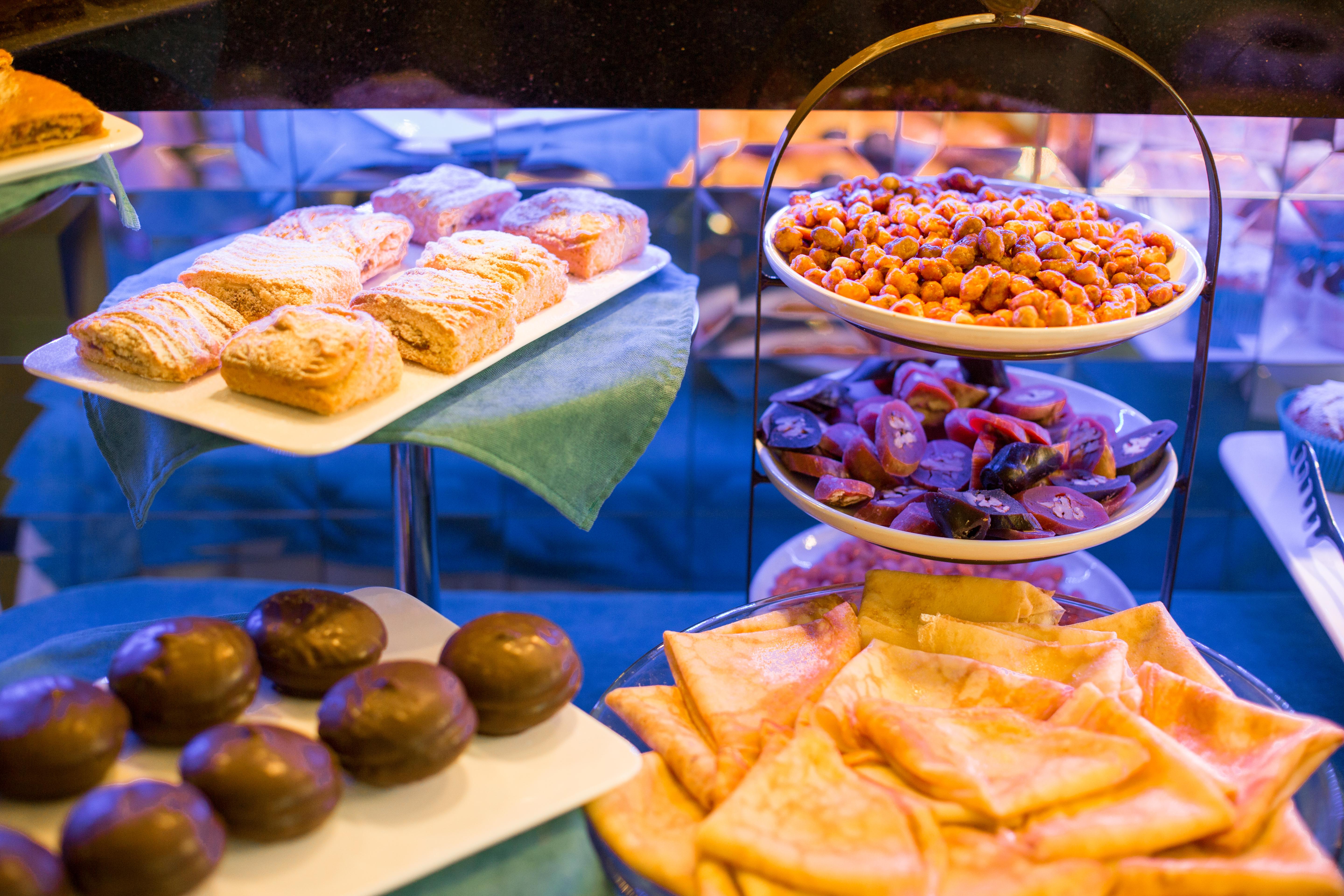 River Side Hotel Tbilisi Eksteriør bilde A display of pastries and other snacks at a bakery in Madrid, Spain